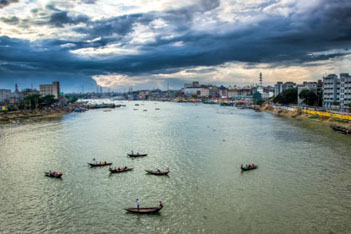 Paddle boats in a large urban river