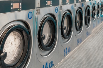 Row of washing machines in public laundry